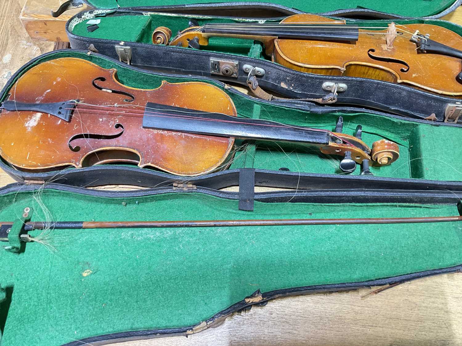 Lot 308 Three cased violins, for restoration.