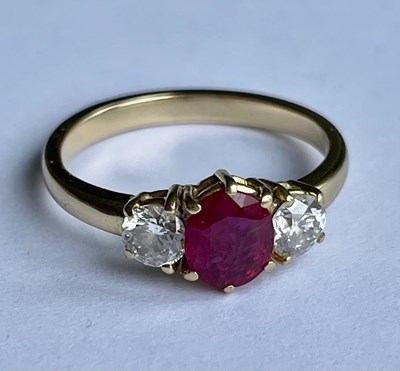 Lot 299 - An 18ct yellow gold ruby and diamond three...