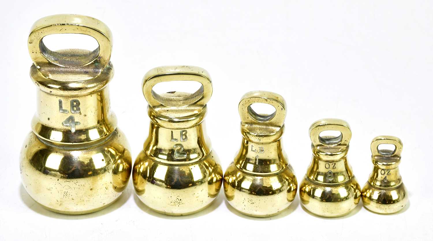 Lot 2149 - Five brass bell weights, from 4oz up to 4lb.