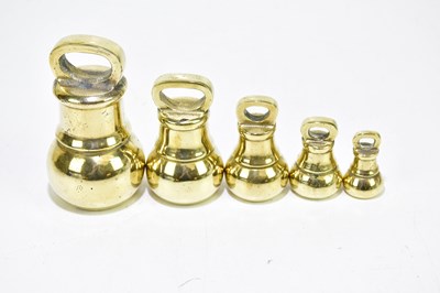 Lot 2149 - Five brass bell weights, from 4oz up to 4lb.