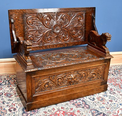 Lot 2417 - An early 20th century Flemish style carved oak...