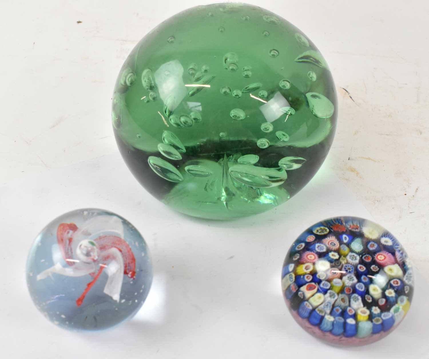 Lot 556 - A large green glass dump weight, two...