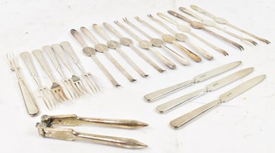 Lot 738 - A set of twelve silver plated lobster pics, a...