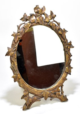 Lot 121 - A Black Forest easel back dressing table mirror