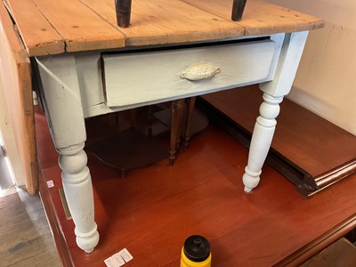 Lot 4 - An old pine dining table with a single...