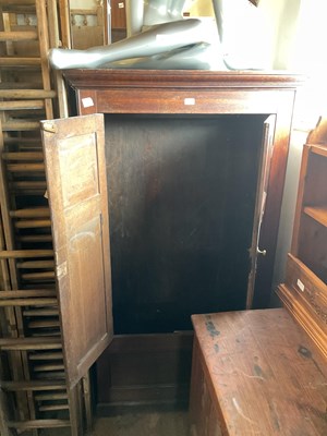 Lot 15 - An 18th century oak tack cupboard with moulded...