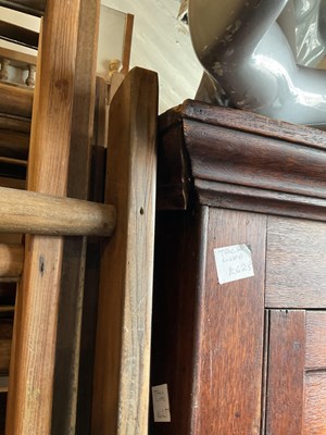 Lot 15 - An 18th century oak tack cupboard with moulded...