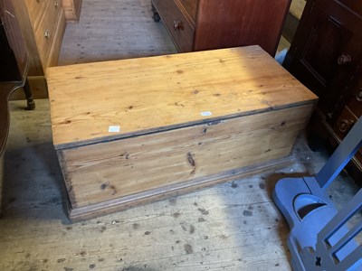 Lot 20 - An old pine blanket chest with iron handles,...