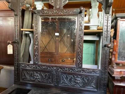 Lot 29 - A 19th century carved oak hall stand with...