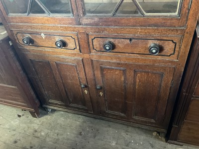 Lot 30 - An 18th century oak cabinet with moulded...
