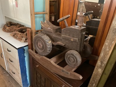 Lot 73 - A modern carved rocking tractor.