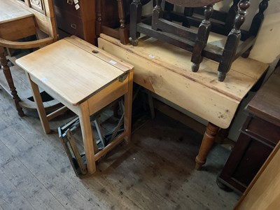 Lot 76 - An old pine drop-leaf kitchen table on turned...