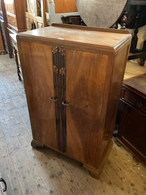 Lot 78 - An Art Deco walnut tallboy, the twin panelled...