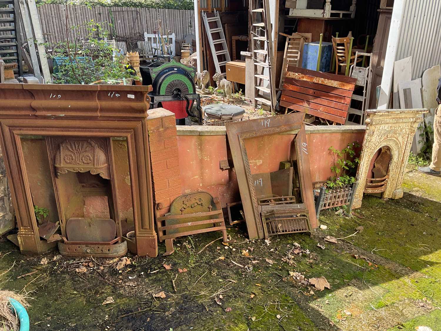 Lot 119 - Three cast iron fireplaces, with assorted fire...