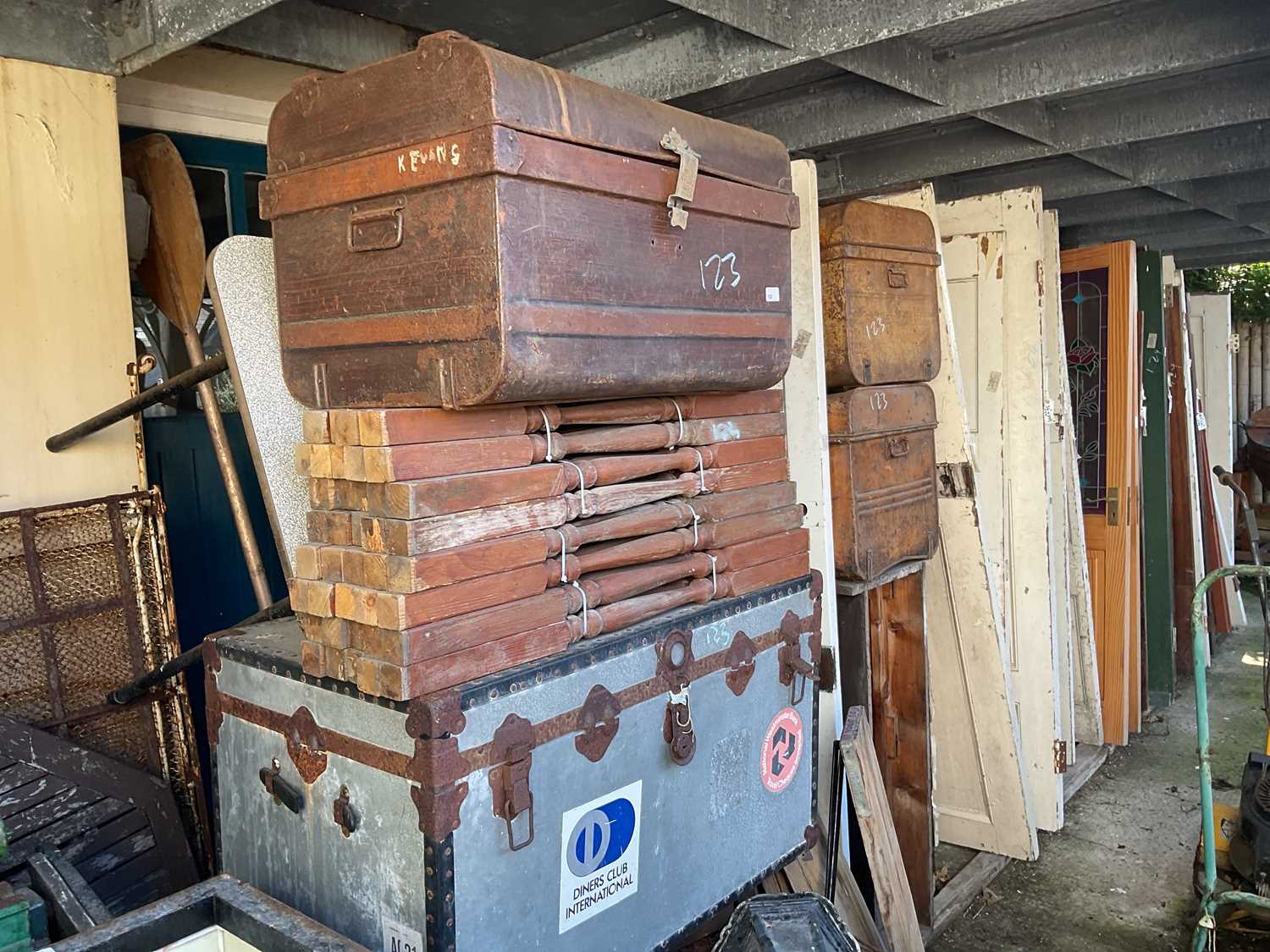 Lot 123 - Three metal travelling trunks, with a...