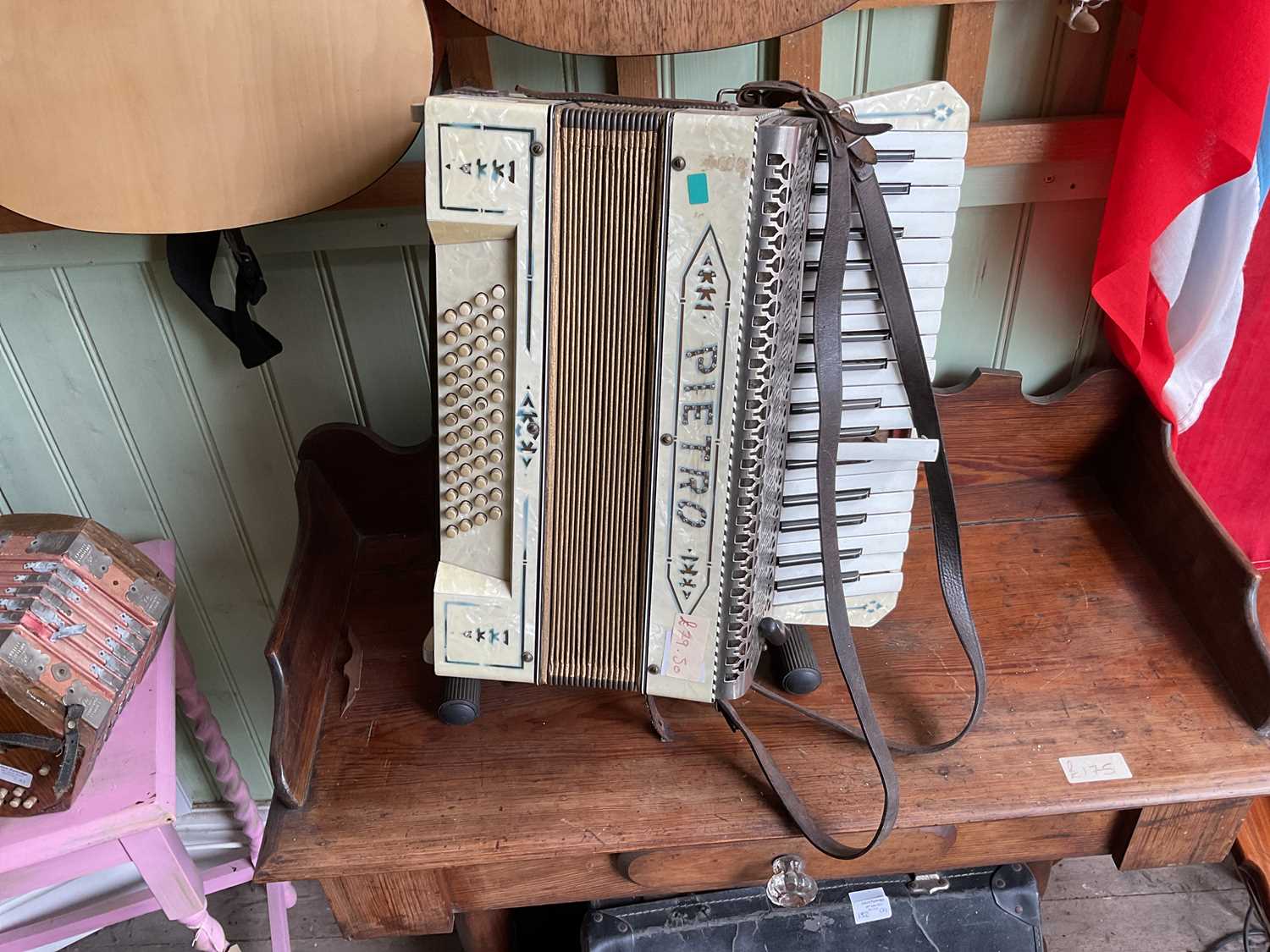 Lot 152 - PIETRO; a piano accordion with associated case...