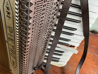 Lot 152 - PIETRO; a piano accordion with associated case...