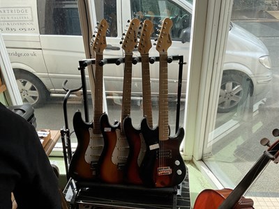 Lot 158 - Four modern electric guitars, including an...