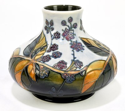 Lot 72 - SALLY TUFFIN FOR MOORCROFT; a squat vase...