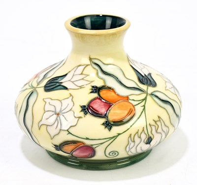 Lot 42 - MOORCROFT; a squat vase decorated with floral...