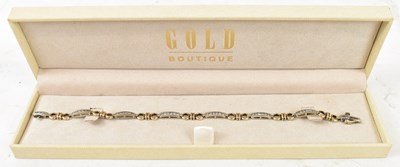 Lot 848 - A 9ct white and yellow gold bracelet set with...