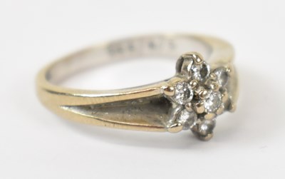 Lot 860 - AN 18ct white gold ring with seven white...