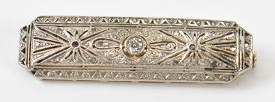 Lot 879 - A white metal brooch set with central white...