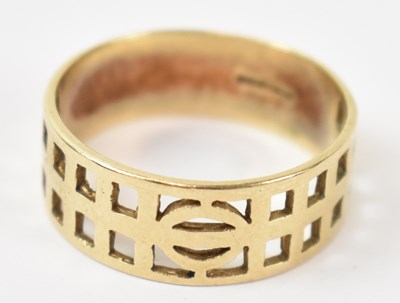 Lot 905 - A 9ct yellow gold pierced ring, size U, approx...