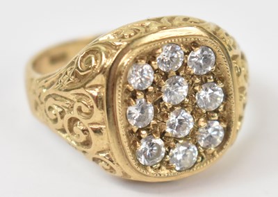 Lot 857 - A 9ct yellow gold ring set with ten white...