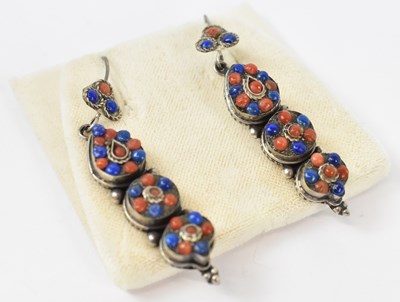Lot 929 - A pair of yellow metal earrings with blue and...