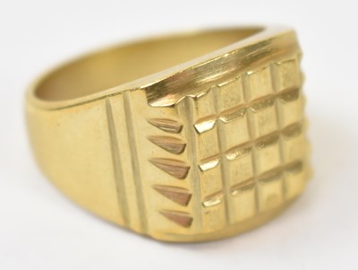 Lot 876 - A yellow metal gents ring, stamped 18k, size U,...