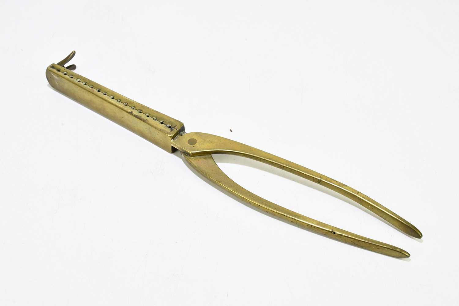 Lot 2555 A brass musket ball mould.