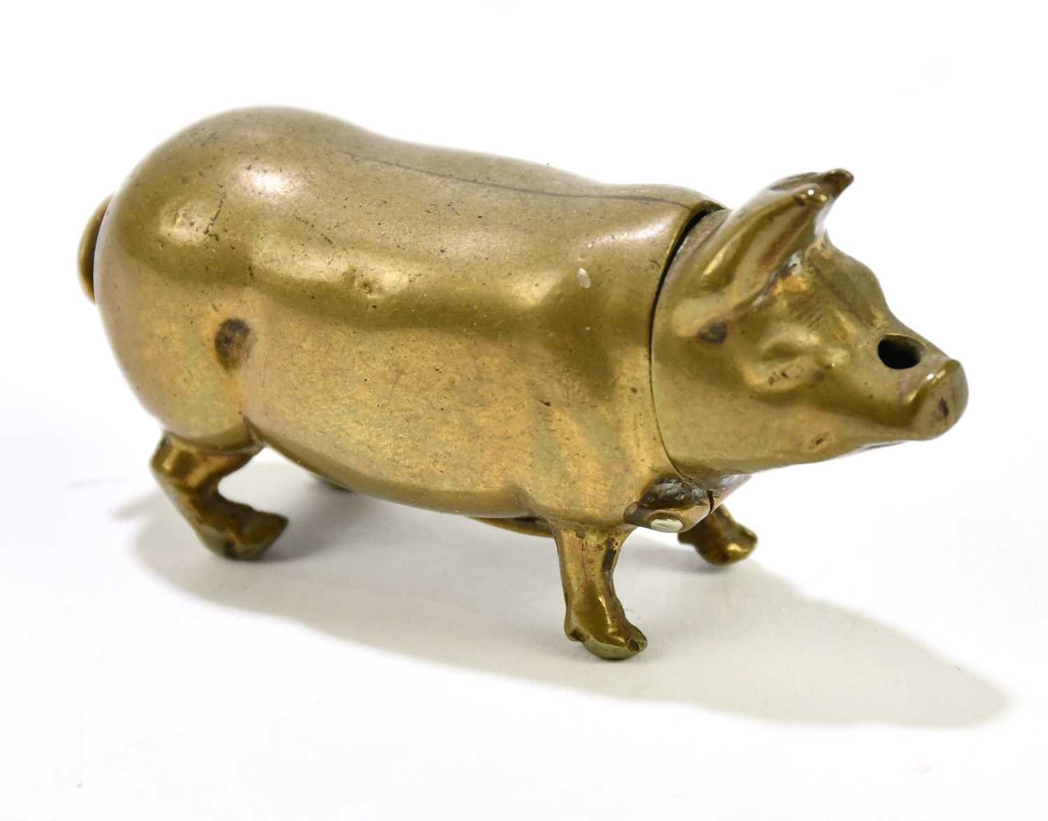 Lot 2475 - A novelty brass pig vesta case.