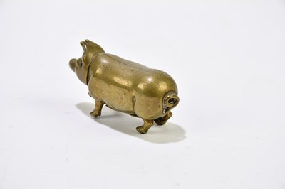 Lot 2475 - A novelty brass pig vesta case.