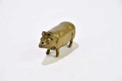 Lot 2475 - A novelty brass pig vesta case.