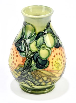 Lot 71 - SALLY TUFFIN FOR MOORCROFT; a squat baluster...