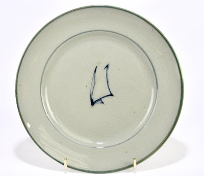 Lot 32 - WALTER MOORCROFT; a plate decorated in the...