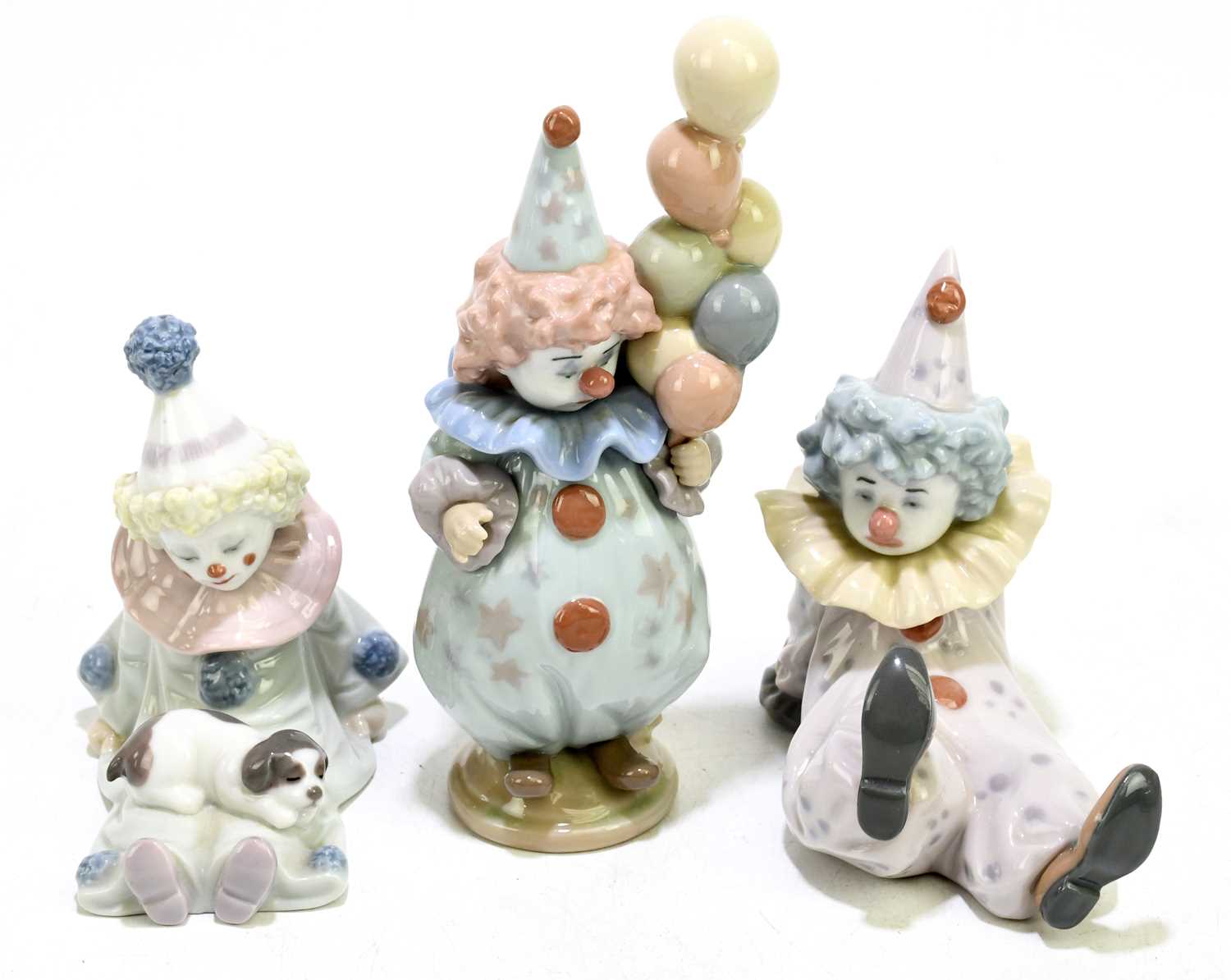 Lot 626 - LLADRO; three figures of clowns comprising...