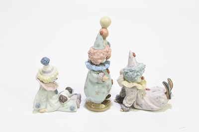 Lot 626 - LLADRO; three figures of clowns comprising...