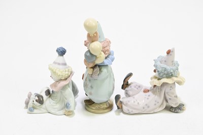 Lot 626 - LLADRO; three figures of clowns comprising...