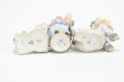 Lot 626 - LLADRO; three figures of clowns comprising...
