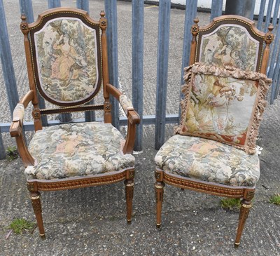 Lot 77 - A reproduction open arm elbow chair with...