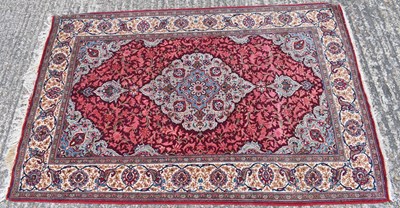 Lot 186 - A hand knotted Persian design red ground...