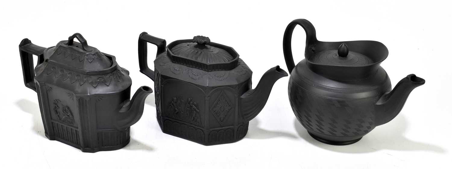 Lot 558 - Three early 19th century black basaltware teapots