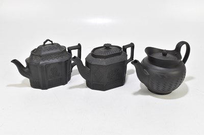 Lot 558 - Three early 19th century black basaltware teapots