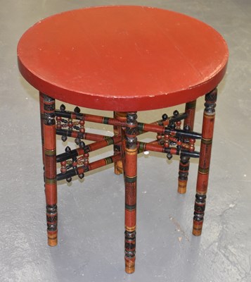 Lot 87 - A red painted folding circular topped table.