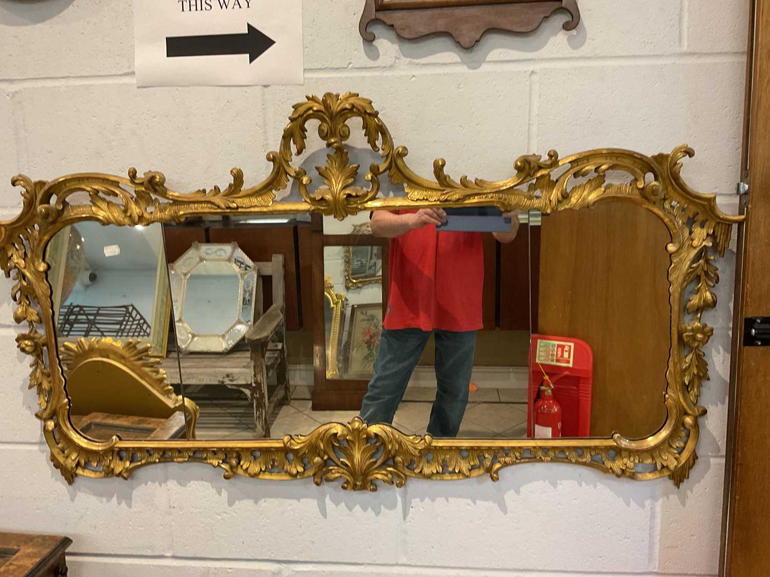 Lot 36 - A decorative gilt framed wall mirror with...