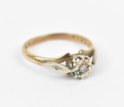 Lot 632 - A 9ct yellow gold ring set with central white...