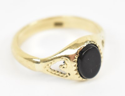 Lot 650 - A 9ct yellow gold signet ring set with central...