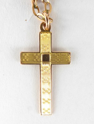 Lot 1221 - A 9ct gold cross with textured pattern, length...
